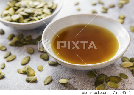 Bowl with pumpkin seed oil Bowl with pumpkin seed oil 75924565