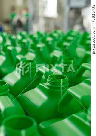 Empty plastic cans green color. Empty plastic cans green color. 75926432