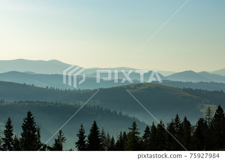 Beautiful early morning with fog between mountains Beautiful early morning with fog between mountains 75927984
