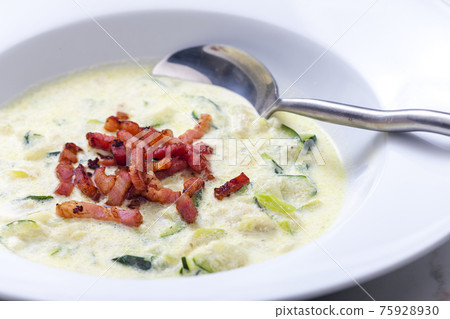 zucchini soup with fried bacon 75928930