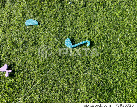 Toys scattered in the lawn garden Toys scattered in the lawn garden 75930329