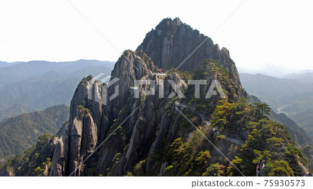 Huangshan Mountain in Anhui Province, China. View of Yuping Hotel and Celestial Capital Peak with Huangshan mountain path leading from Lotus Peak. Scenic view on Huangshan Mountain, China. 75930573