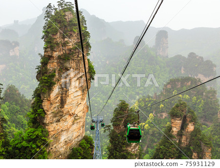 Cablecars on its way to the top among sandstone pillars and peak 75931129