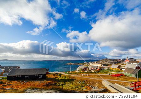 Nuuk city old harbor fjord panorama with clouds over the blue sky in the background, Greenland 75931194