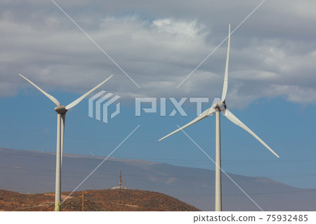 electric wind turbines farm, blue sky background electric wind turbines farm, blue sky background 75932485