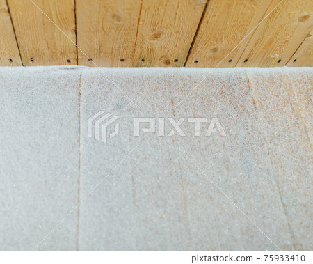 snow patina on wooden lags background 75933410