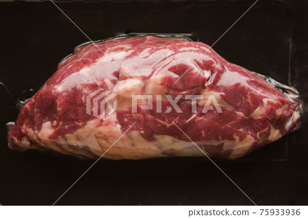 fresh vacuum packed meat on black background fresh vacuum packed meat on black background 75933936