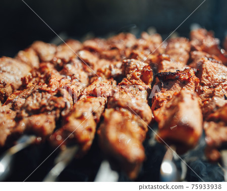 grilled barbecue meat on skewers with smoke grilled barbecue meat on skewers with smoke 75933938