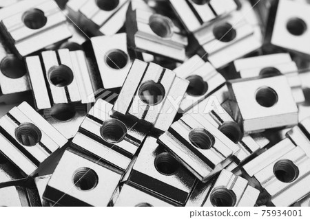 slide screw nuts heap, closeup view slide screw nuts heap, closeup view 75934001