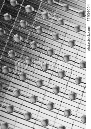 slide screw nuts in a row, abstract industrial background slide screw nuts in a row, abstract industrial background 75934004