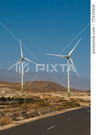 electric wind turbines farm, blue sky background electric wind turbines farm, blue sky background 75934008
