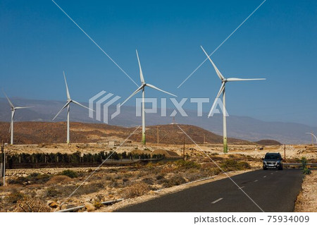 electric wind turbines farm, blue sky background electric wind turbines farm, blue sky background 75934009
