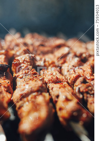 grilled barbecue meat on skewers with smoke grilled barbecue meat on skewers with smoke 75934013