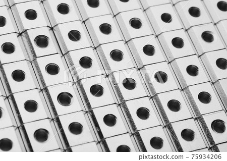 slide screw nuts in a row, abstract industrial background slide screw nuts in a row, abstract industrial background 75934206