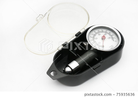 Pressure gauge for measuring air pressure in car tires on a white background Pressure gauge for measuring air pressure in car tires on a white background 75935636