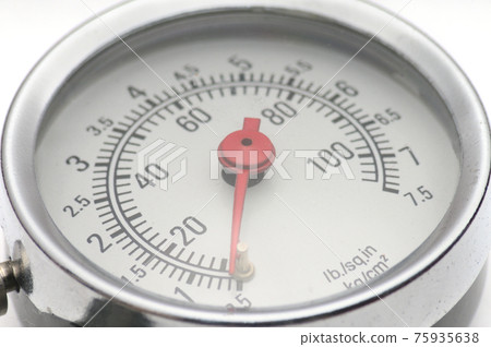 Pressure gauge for measuring air pressure in car tires on a white background Pressure gauge for measuring air pressure in car tires on a white background 75935638