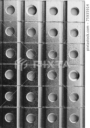slide screw nuts in a row, abstract industrial background slide screw nuts in a row, abstract industrial background 75935914