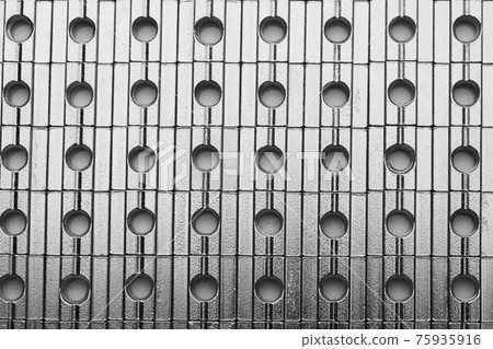 slide screw nuts in a row, abstract industrial background slide screw nuts in a row, abstract industrial background 75935916