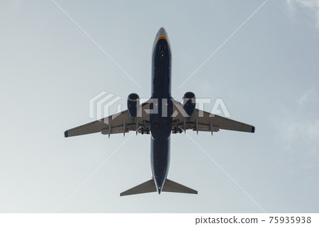 airplane in the sky, bottom view 75935938