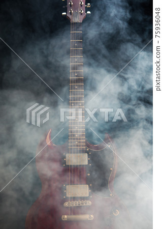 electric guitar in smoke, closeup view electric guitar in smoke, closeup view 75936048