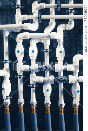 white plastic pipes in boiler room white plastic pipes in boiler room 75936064