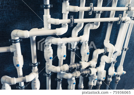 white plastic pipes in boiler room white plastic pipes in boiler room 75936065