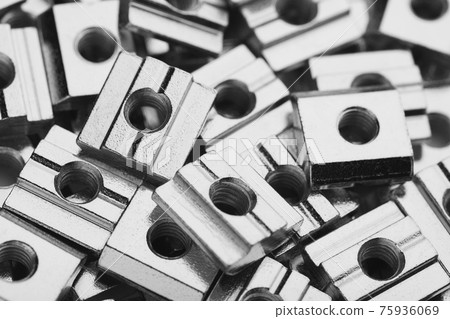 slide screw nuts heap, closeup view slide screw nuts heap, closeup view 75936069
