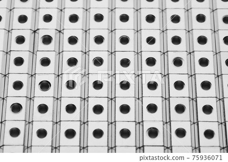 slide screw nuts in a row, abstract industrial background slide screw nuts in a row, abstract industrial background 75936071