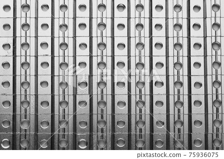 slide screw nuts in a row, abstract industrial background 75936075