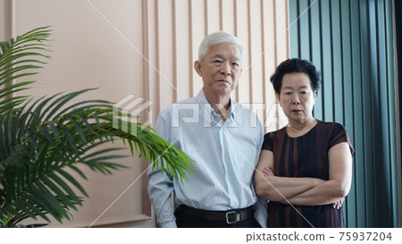 Smart business Asian senior couple happy together in luxury interior house 75937204