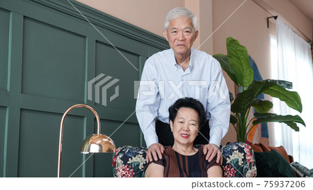 Smart business Asian senior couple happy together in luxury interior house Smart business Asian senior couple happy together in luxury interior house 75937206