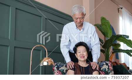 Smart business Asian senior couple happy together in luxury interior house Smart business Asian senior couple happy together in luxury interior house 75937207