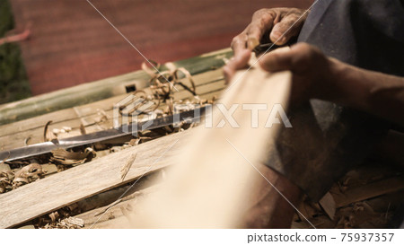 Elder man hand use knife cutting bamboo craftman work in Thailand Elder man hand use knife cutting bamboo craftman work in Thailand 75937357