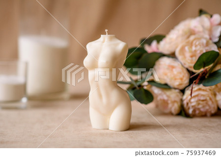 Beautiful candle in the shape of a human body 75937469