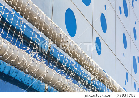 Industrial metal pipeline and modern city building Industrial metal pipeline and modern city building 75937795