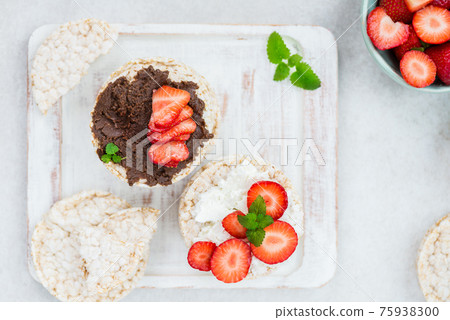 Healthy Snack from Rice Cakes with Hazelnut Spread, Ricotta Chee Healthy Snack from Rice Cakes with Hazelnut Spread, Ricotta Chee 75938300