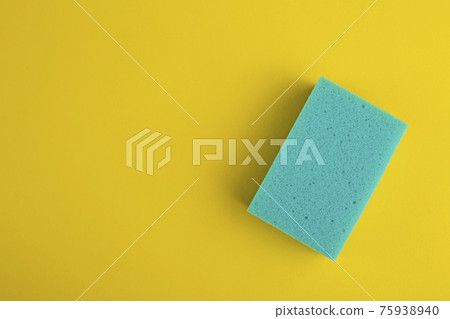 Kitchen washcloth on yellow background. Sponges. Washcloths for cleaning. 75938940