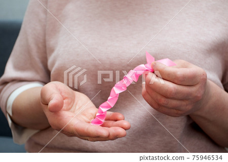 How to make silk ribbon rose flower. Step 8. Step by step photo instruction. Woman hands making decorative flower 75946534