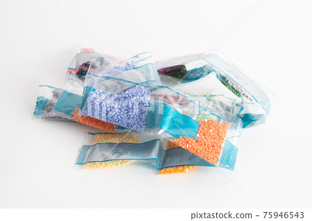 Bags with beads of different colors for Collecting diamond paint. Set of plastic bags with glass beads Bags with beads of different colors for Collecting diamond paint. Set of plastic bags with glass beads 75946543