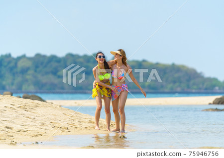 Portrait of woman posing outdoors at the sea beach Portrait of woman posing outdoors at the sea beach 75946756
