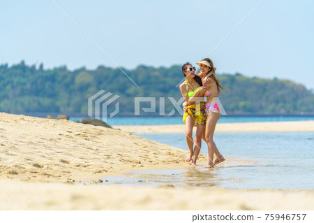 Portrait of woman posing outdoors at the sea beach Portrait of woman posing outdoors at the sea beach 75946757