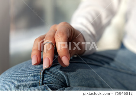 Close-up silver thin ring on female hand, concept modern jewellery accessories shop 75946812