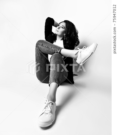 Black and white portrait of calm adult woman in 75947012