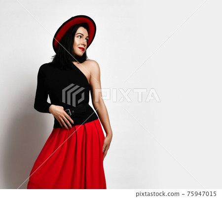 Flirty mature woman in black sleeveless top, red 75947015