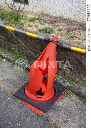 Cracked and distorted road cone Cracked and distorted road cone 75948525