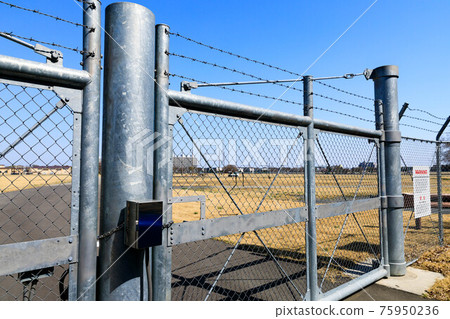 Saitama Prefecture U.S. Military Tokorozawa Communication Base Net Fence Gate Warning Board and Blue Sky 75950236