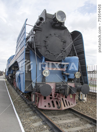 The blue express steam locomotive which is accelerating momentum 125 km/hour The blue express steam locomotive which is accelerating momentum 125 km/hour 75954408