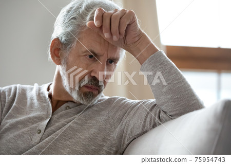 Upset senior man look in distance feeling depressed Upset senior man look in distance feeling depressed 75954743