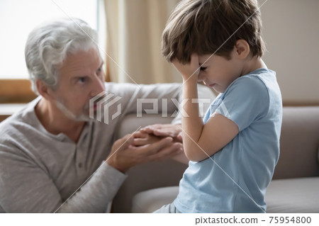 Caring old grandfather comfort sad little grandson Caring old grandfather comfort sad little grandson 75954800