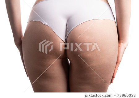 Fat female body with cellulite, fatty hips and buttocks, gray background, studio shot Fat female body with cellulite, fatty hips and buttocks, gray background, studio shot 75960058